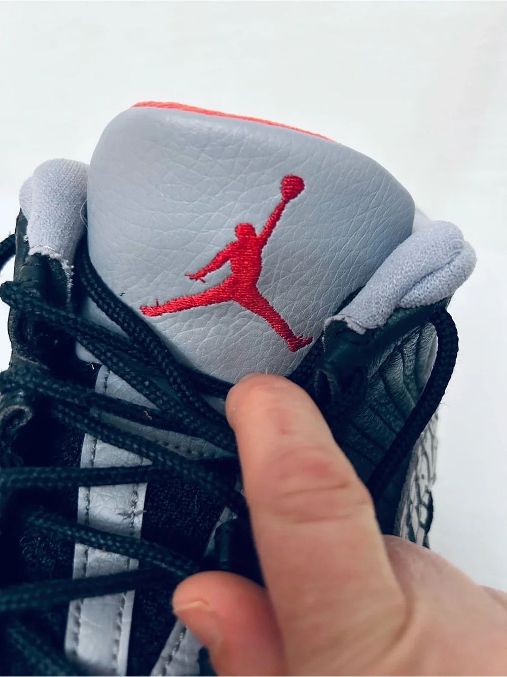 Air Jordan 11 Retro Low IE‎ Men's Black/Grey Sneakers with Red Jumpman Accents